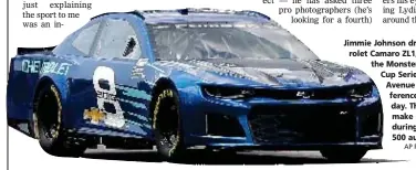  ?? AP PHOTO BY PAUL SANCYA ?? Jimmie Johnson drives the 2018 Chevrolet Camaro ZL1, a new race car for the Monster Energy NASCAR Cup Series, down Jefferson Avenue during a news conference in Detroit, Thursday. The new Camaro will make its on-track debut during the 2018 Daytona 500...