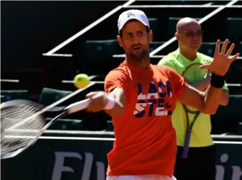  ?? (Getty) ?? Djokovic watched on by his new coach, Andre Agassi