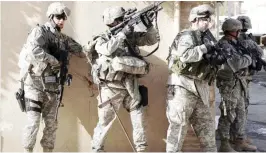  ??  ?? American soldiers in action in Mosul in this file photo.