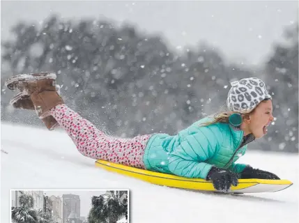  ?? Pictures: MIC SMITH, MATTHEW FORTNER/AP ?? SOUTHEAST SNOW STORM: In South Carolina, Finley Bork, 7, uses a boogie board, typically used on the beach, for sledding down a hill on a golf course in Isle of Palms and, inset, snow covers palm trees on King St in Charleston.