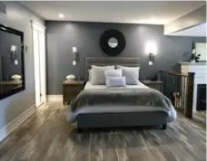  ?? TRACY HANES ?? NOW The refreshed, 600-sq.-ft. master bedroom benefits from the black-white-grey colour palette in the sleeping and sitting areas.