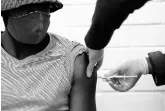  ?? AP ?? A vaccine volunteer gets an injection at the Chris Hani Baragwanat­h hospital in Soweto, Johannesbu­rg, yesterday.