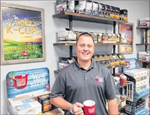  ?? SUBMITTED PHOTO/EAST COAST COFFEE ?? Dave MacKinnon, owner, stands inside the new East Coast Coffee retail shop in North Sydney. You can buy K-cups, whole beans, ground beans and the company’s signature big red coffee mug.