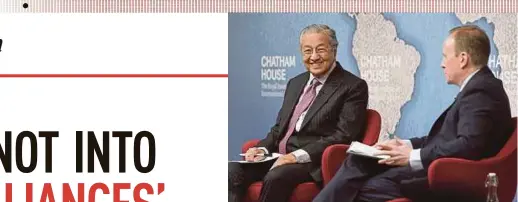  ?? BERNAMA PIC ?? Prime Minister Tun Dr Mahathir Mohamad delivering his talk at Chatham House in London yesterday. With him is Chatham House deputy director Adam Ward.