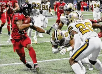  ?? BOB ANDRES / BANDRES@AJC.COM ?? In the first game this season against the Saints, Falcons running back Devonta Freeman had 24 carries for 91 yards and a touchdown in Atlanta’s 20-17 home win Dec. 7.