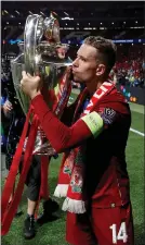  ??  ?? Liverpool captain Jordan Henderson with Champions League trophy