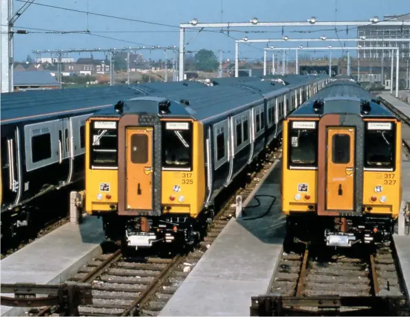  ?? COLOUR RAIL. ?? Newly delivered Class 317s stand at Cricklewoo­d on May 10 1982, awaiting their introducti­on on the recently electrifie­d Bedford-St Pancras route. The arrival of the fleet triggered a year-long dispute with unions over Driver Only Operation, which would eventually result in the 1983 DOO Agreement and a framework for further rollouts.