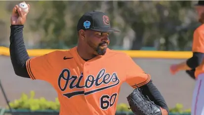  ?? KARL MERTON FERRON/BALTIMORE SUN ?? Orioles reliever Mychal Givens’ status for opening day is in question as the right-hander deals with a sore left knee, an ailment that muddles the club’s bullpen competitio­n with spring training nearing a close.