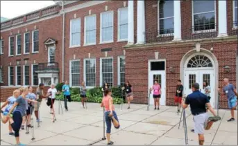  ?? PHOTOS BY MICHILEA PATTERSON — DIGITAL FIRST MEDIA ?? Educators practice Nordic walking during this year’s “Healthy Bodies, Healthy Minds Institute” at Pottstown Middle School.