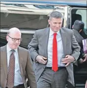  ?? Mark Wilson Getty Images ?? MICHAEL FLYNN, right, is apparently cooperatin­g with the inquiry into Trump staff ties with Russia.