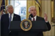  ?? AP FILE ?? President Donald Trump listens as Attorney General Jeff Sessions speaks in February in the Oval Office of the White House in Washington, after Vice President Mike Pence administer­ed the oath of office to Sessions. In invoking Hillary Clinton’s use of a...