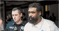  ?? JULIUS CONSTANTIN­E MOTAL/AP ?? Grafton Thomas, right, has been charged with stabbing five people.