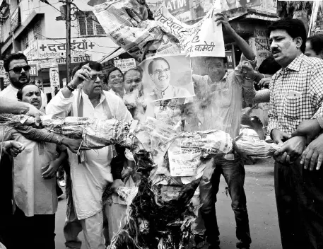  ?? PTI ?? Madhya Pradesh Congress party activists burn an effigy of Chief Minister Shivraj Singh Chouhan in Bhopal to protest the killing of six farmers in police firing on June 6