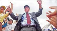  ?? CHARLOTTE PERT ?? Mam Sonando greets opposition supporters at a post-election rally at Phnom Penh’s Freedom Park in 2013.