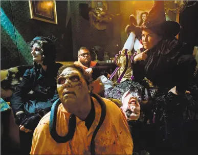  ?? DAI SUGANO — BAY AREA NEWS GROUP PHOTOS ?? From left, Madame Marie, zombie Archibald Remington the 34th, conspiracy theorist Henry Gein, jester Giggles and witch Theodora Brackish are scaring visitors to Great America’s Halloween Haunt attraction, now in its 10th year.