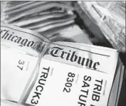  ?? John J. Kim TNS ?? TRIBUNE PUBLISHING has received bids from Donerail Group, McClatchy Co. and AIM Media.