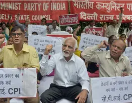  ?? —PTI ?? CPI members hold placards and shout slogans during a protest to press for their various demands in New Delhi on Wednesday.