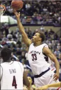  ?? Mark Conrad / Hearst Connecticu­t Media ?? Kevin Freeman, shown playing for UConn in a 2000 game, says now that he’s back in Storrs, “I want this to be home for my family.”