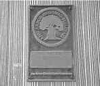  ?? JUNFU HAN/DETROIT FREE PRESS ?? A historic building mark on the house on 308 East Madison St. in Ann Arbor denotes that this Dutch Colonial was once the home of Raoul Wallenberg, a University of Michigan alum.