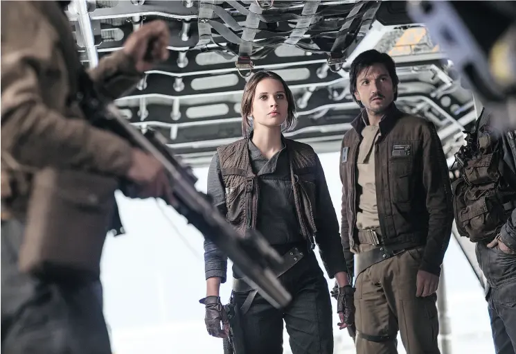  ?? JONATHAN OLLEY / LUCASFILM LTD. VIA THE ASSOCIATED PRESS ?? Felicity Jones and Diego Luna in a scene from director Gareth Edwards’ Rogue One: A Star Wars Story. The movie is available on DVD and Blu-ray on April 4.