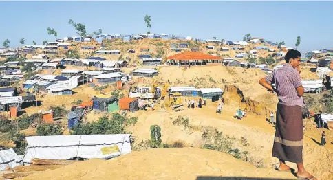  ??  ?? Temporary shelters cover a hill at Balukhali refugee camp near Cox’s Bazar, Bangladesh. — Reuters photo