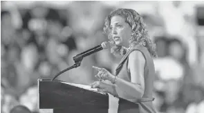  ?? JASON BEHNKEN EPA ?? Debbie Wasserman Schultz speaks to the crowd during a campaign stop for Hillary Clinton at the Florida State Fairground­s Entertainm­ent Hall in Tampa.