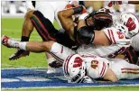  ?? JOE SKIPPER / ASSOCIATED PRESS ?? QB Malik Rosier, sacked during the Orange Bowl loss to Wisconsin, is expected to face competitio­n in spring practice.