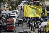  ?? BILAL HUSSEIN — THE ASSOCIATED PRESS ?? A convoy of tanker trucks carrying Iranian diesel crossed the border from Syria into Lebanon and arrived at the eastern town of el-Ain, Lebanon, on Thursday.