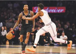  ?? Sarah Stier / TNS ?? The Phoenix Suns Jamal Crawford controls the ball against the New York Knicks’ Frank Ntilikina in a 2018 game at Madison Square Garden. Crawford is joining the Brooklyn Nets after sitting out since his last game in April of last year.