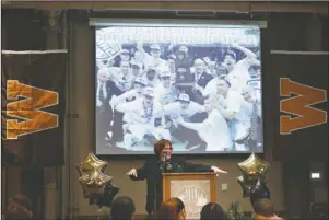  ?? The Associated Press ?? THROWBACK THURSDAY: Western Michigan’s Athletic Director Kathy Beauregard makes a speech March 16, 2014, to honor the men’s basketball team’s effort before Selection Sunday at Cityscape Events Center in Kalamazoo, Mich. The coronaviru­s pandemic didn’t just wipe out the NCAA Tournament games when it hit college basketball. The coaching carousel is also on hold. Before long, WMU athletic director Kathy Beauregard was dealing with restrictio­ns on travel and external hires, and it was obvious this would not be a normal coaching search.