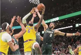  ?? Maddie Meyer/Getty Images ?? Lakers star LeBron James posted 41 points, nine rebounds and eight assists against the Celtics, but his efforts went for naught in the loss.