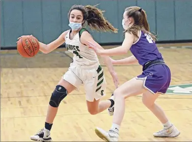  ?? Lori Van Buren / Times Union ?? Schalmont junior point guard Payton Graber, seen in Thursday’s game against Catholic Central, had a game-high 22 points on Saturday to climb atop the Sabres’ all-time scoring list with 1,364 points.