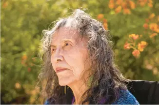  ?? TAILYR IRVINE/THE NEW YORK TIMES ?? Anita Yellowhair, 84, a Navajo survivor who was taken from her family in Steamboat, Ariz., to live at the Intermount­ain Indian School in Brigham City, Utah, sits outside her home in Phoenix on Aug. 22.“It was just what you did, no questions asked,” said Yellowhair. “They hired me out on weekends to clean the homes of white families.”