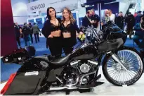  ??  ?? LAS VEGAS: Promotion hostesses Justina (left) and Ty (right) pose beside a Harley Davidson motorcycle equipped with Cerwin Vega soundsyste­m at the 2017 Consumer Electronic Show (CES) in Las Vegas on Saturday.