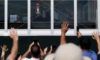  ?? SAUL LOEB/AFP/GETTY IMAGES ?? U.S. President Donald Trump has been watching the U.S. Women’s Open from an enclosed viewing area.