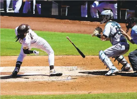  ?? MEG MCLAUGHLIN U-T ?? Padres right fielder Fernando Tatis Jr. leans back to avoid getting hit by a pitch as Marlins backstop Jacob Stallings makes the catch.