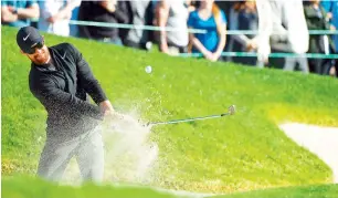  ?? AFP ?? Patrick Rodgers plays his shot out of the bunker on the 18th hole during the third round of the Farmers Insurance Open at Torrey Pines South. —