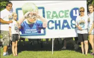  ?? Contribute­d photo ?? Steven and Rebecca Kowalski, Chase’s parents and sisters Erin, left, and Brittany at a previous Race4Chase.