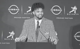  ?? ?? Southern Cal quarterbac­k Caleb Williams speaks to the media after winning the 2022 Heisman Trophy in New York. BRAD PENNER/USA TODAY SPORTS