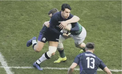  ??  ?? 0 This tackle by Ireland’s Chris Farrell on Sam Johnson of Scotland would be illegal under the proposed new law.