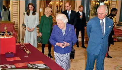  ?? GETTY IMAGES ?? Queen Elizabeth and Prince Charles lead a family group to a reception at Buckingham Palace to mark the 50th anniversar­y of the investitur­e of the Prince of Wales in 1969.