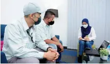  ?? – Bernama photo ?? Two former inmates currently employed at Panasonic being interviewe­d by Bernama.