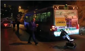  ?? Images ?? Israeli security forces inspect the bus after a shooting attack that injured eight, including a pregnant woman, outside Jerusalem’s Old City early on Sunday. Photograph: Ahmad Gharabli/AFP/Getty