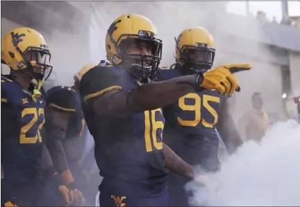  ?? RAYMOND THOMPSON - ASSOCIATED PRESS FILE ?? West Virginia cornerback and Pottsgrove product Terrell Chestnut (16) leads his team out of the tunnel before a game on Sept. 5, 2015, in Morgantown, W.Va.