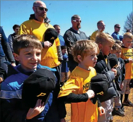  ?? BOB RAINES — DIGITAL FIRST MEDIA ?? Players and coaches stand with their hats over their heart during the national anthem at the North Penn Little League Opening Day Saturday.