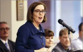  ?? DON RYAN — THE ASSOCIATED PRESS FILE ?? In this file photo, Oregon Gov. Kate Brown speaks in Portland, Ore. The evangelist Franklin Graham recently asked thousands of people at an Oregon rally to pray for the state’s Democratic governor, saying she should be a Christian. Yoga and meditation suit Brown just fine, she told reporters Thursday when asked if she follows a certain faith.