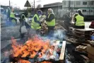  ??  ?? Gilets Jaunes (Yellow vest) protestors man a barricade in Montabon, northweste­rn France, at an access to an oil depot they block since December 2 as part of the Gilets Jaunes protests. Photograph: Jean-François Monier/AFP/Getty Images