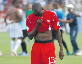  ?? THE CANADIAN PRESS ?? Canada’s Atiba Hutchinson leaves the field after a game against Honduras during a 2014 World Cup
qualifying soccer match. Canada’s standing in the FIFA rankings is 117th.