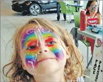  ?? DESIREE ANSTEY/JOURNAL PIONEER ?? Sylvie Noall, 5, wears a brightly painted butterfly by artist Anna Doran, 13, who runs her own business called, Anna’s Colourful Creations. Even though the self-taught face painter has been honing her craft over the summer, her work suggests that she...