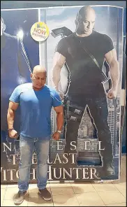  ??  ?? MUSCLE FLEXING: Chief Superinten­dent Ronald dela Rosa poses beside a movie poster of Vin Diesel in this Dec. 19, 2015 photo he posted on his Facebook page. He is called Bato (rock) by friends.